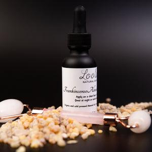 matte Black 30 ml frankincense almond rose face oil with face roller included 